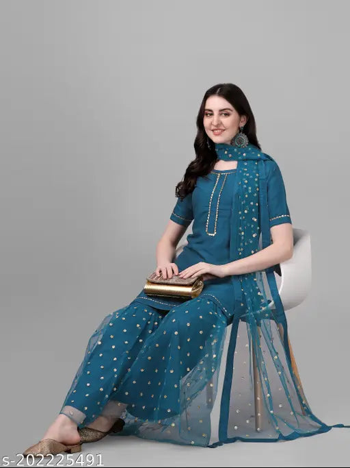 Teal silk blend kurta and sharara with dupatta, embroidered and sequined women's party wear outfit. Single set available in sizes S-XXL, origin India