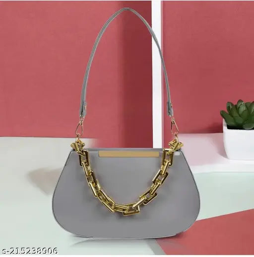 Grey faux leather travel slingbag, trendy cloud shape for women's casual style. Spacious compartment with internal divider and utility pockets. High-quality PU leather, adjustable strap, and zip closure. Made by NBYCRAFT Bag, crafted in India