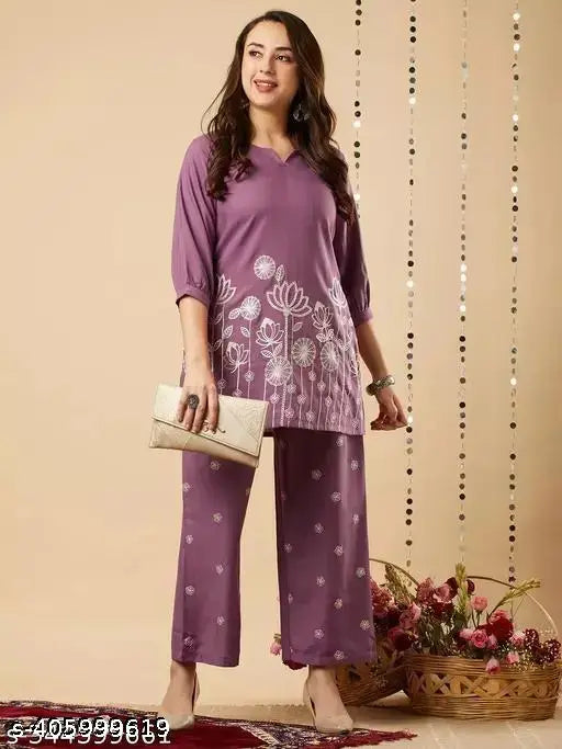 Embroidered net cotton blend kurta set with palazzo bottoms, three-quarter sleeves. Indian ethnic wear for women