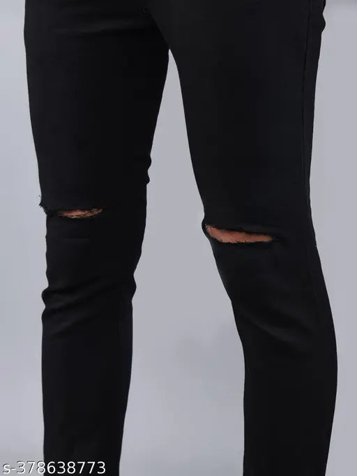 Men's black stretchable denim jeans with knee damage. Durable, comfortable fit for versatile style under INR 400
