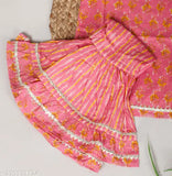 Red cotton printed kurti sharara set for baby girls with dupatta, featuring an anarkali top and sharara bottom, adorned with gota patti and dori. Comes in various sizes from 6-12 months to 5-6 years. Handmade in India