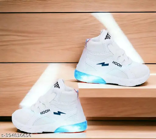 White canvas and rubber sneakers with LED lighting for kids aged 0-7 years, featuring adjustable velcro closures and breathable cotton blend material