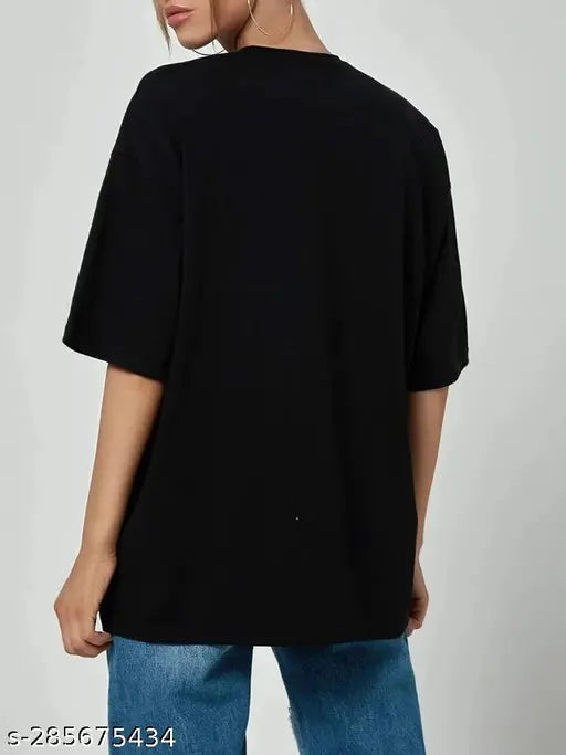 Black cotton blend oversize t-shirt with off-shoulder design, printed pattern, three-quarter sleeves. Women's size M for bust 40in and length 27in. Brooklyn style fashion