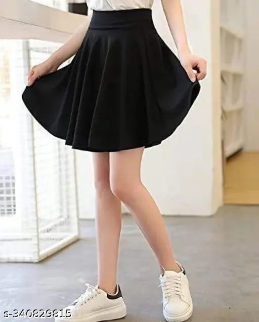 Black polycotton skater skirt with attached inner shorts and flared inskirt. Stretchy, double-layer design for comfort during sports. A-line silhouette with high waistband and scallop hem texture. Perfect fitting from size 26 to XXL. Made in India