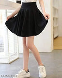Black polycotton skater skirt with attached inner shorts and flared inskirt. Stretchy, double-layer design for comfort during sports. A-line silhouette with high waistband and scallop hem texture. Perfect fitting from size 26 to XXL. Made in India