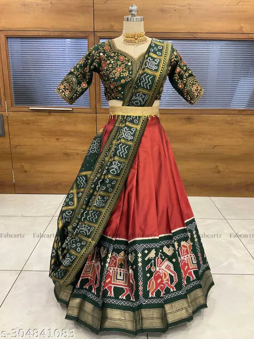 Art Silk traditional half saree, South Indian style with Ikat patterns and embroidery work. Unstitched set includes Litchi Silk zari work lehenga (3.60M), tafeta silk choli, and dupatta (2.30M). Includes tussles, belt, and best quality fabric. Ready to ship from India