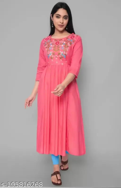 Women's Viscose Rayon A-line Kurta with embroidered pattern, three-quarter sleeves. Close-up of Indian ethnic wear on hanger
