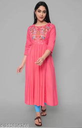 Women's Viscose Rayon A-line Kurta with embroidered pattern, three-quarter sleeves. Close-up of Indian ethnic wear on hanger