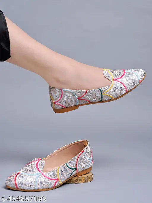 Embellished synthetic Shoetopia ethnic silver flat bellies for women & girls, versatile fashion flat mules on display