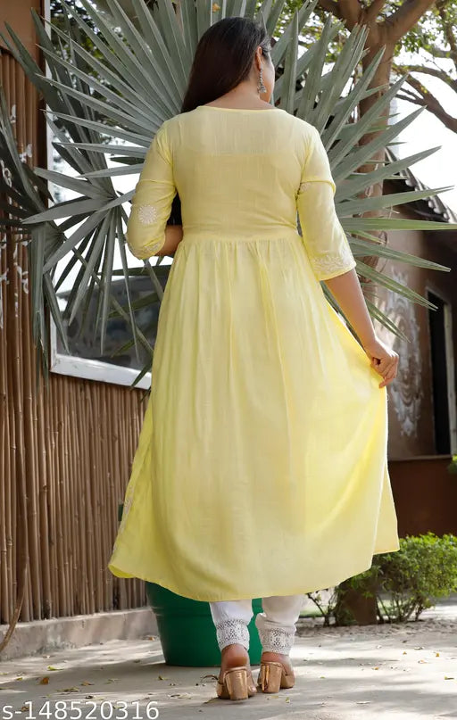 Lemon yellow rayon kurti with floral embroidery, three-quarter sleeves, print combo. Indian fashion for women