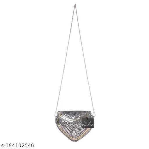 Handmade silver heart sheep-style party slingbag, suede clutch with embroidered net. Vintage handcrafted accessory for parties, accommodates small items. Handmade in India, may have slight imperfections due to artisanal nature