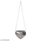 Handmade silver heart sheep-style party slingbag, suede clutch with embroidered net. Vintage handcrafted accessory for parties, accommodates small items. Handmade in India, may have slight imperfections due to artisanal nature