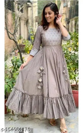 Grey embroidered rayon Anarkali kurta with tassels and latkans, ankle length for women's festive wear. Premium fabric, traditional craftsmanship, perfect for enhancing your ethnic wardrobe
