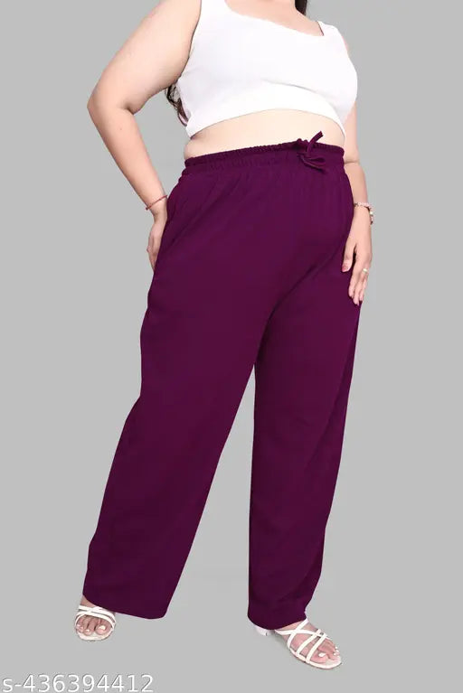Purple plus size Korean baggy style pant, made with stretchable Cotton Lycra. Comfortable elastic band and drawstring waist closure. Solid pattern design with zippered side pockets, 40 inches in length. Premium quality viscose rayon fabric from India