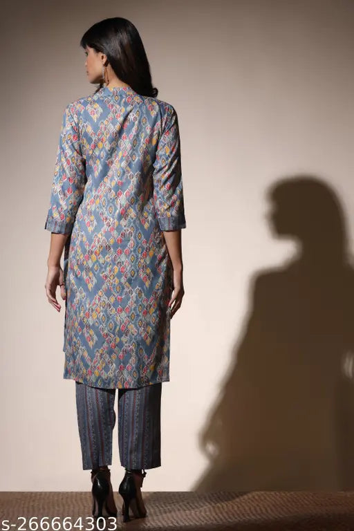 Heavy cotton kurti set with geometric plazzo, smooth georgette dupatta in traditional floral pattern. Indian ethnicwear for special occasions." (124 characters)