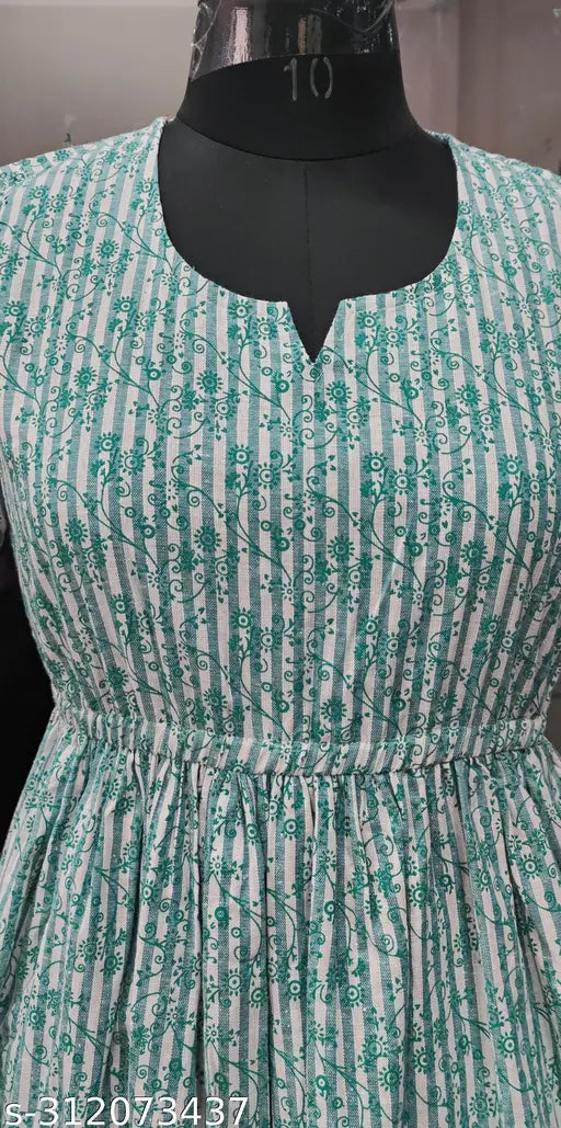 Green cotton blend calf-length fit-and-flare dress, three-quarter sleeves, printed pattern on Indian background