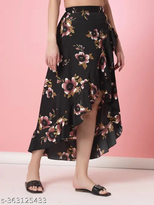 Black crepe A-line skirt with floral print, high low wrap style and ruffles on hem. Elastic waist. OOMPH brand
