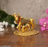 Golden bronze Kamdhenu cow statue with calf, 11cm tall for home decor & gifting