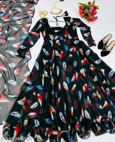 Designer Georgette gown with organza dupatta, printed net, three-quarter sleeves. Indian bridal wear on mannequin