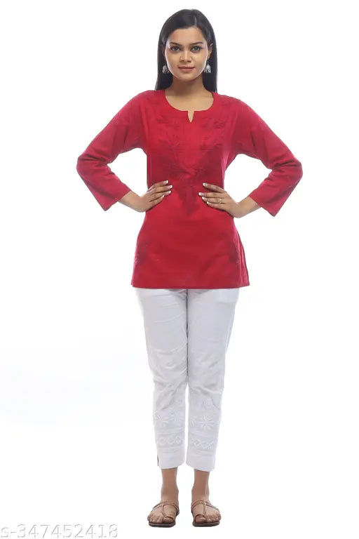 White and golden embroidered cotton kashmiri short kurti with three-quarter sleeves. Handcrafted chikankari art from Lucknow's oldest export brand, Golden Chikan Export." (123 characters)