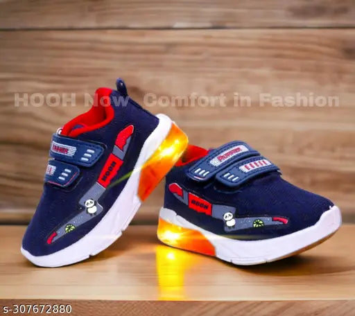 Light blue and orange LED light canvas walking shoes for kids (ages 0-5), featuring breathable cotton blend material, adjustable Velcro closure, and waterproof design. Ideal for parties or everyday wear