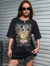 Oversize black cotton t-shirt, short sleeves, printed design. Modern and versatile oversized black tee for men and women