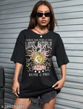 Oversize black cotton t-shirt, short sleeves, printed design. Modern and versatile oversized black tee for men and women
