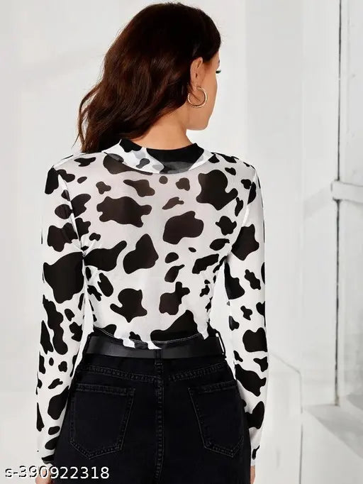 Printed black and white animal lycra long-sleeve T-shirt with crop fit, featuring cow print and sheer sleeves on display