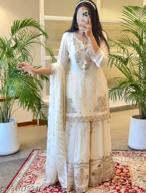 Trendy Chinnon Silk Kurta Set with embroidered floral patterns, three-quarter sleeves, and matching dupatta and gharara, ready to wear