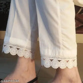 White cotton plazo trousers with elegant lace details, perfect for casual or party wear