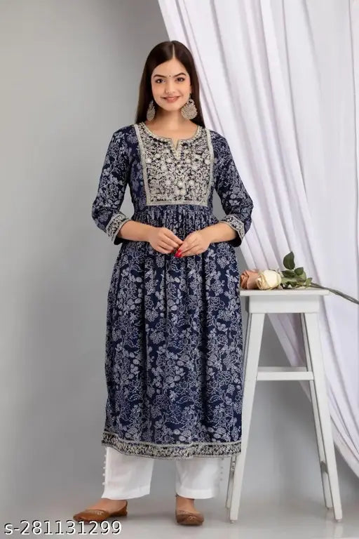 Blue embroidered rayon kurta set with cotton pants, intricate naira cut design on display