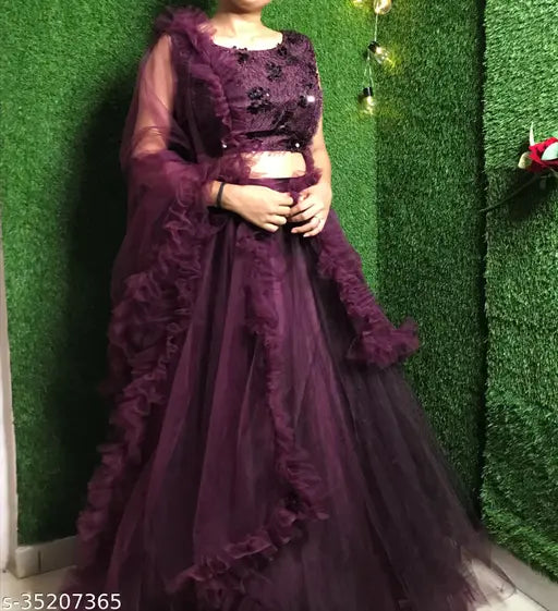 Wine-colored flared net lehenga choli with embroidery, free size for women and girls. Indian ethnic wear, perfect for parties or festivals