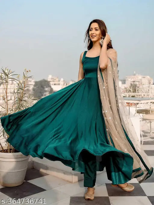 Green solid Anarkali Kurta set (2 pieces) - art silk, embroidered, 3/4 sleeves. Indian ethnic wear on model