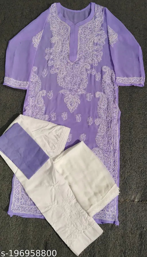 Chiffon and cotton embroidered chiken kurti set with pants, three-quarter sleeves in various sizes from XXS to XXXL. Indian ethnic clothing on display