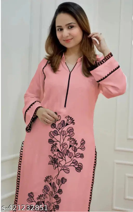 Black rayon kurta set with printed net, long sleeves, pants bottom, adorned with lace detailing and thread embroidery - Indian origin