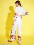 White viscose rayon jumpsuit with cream and red print, three-quarter sleeves on model