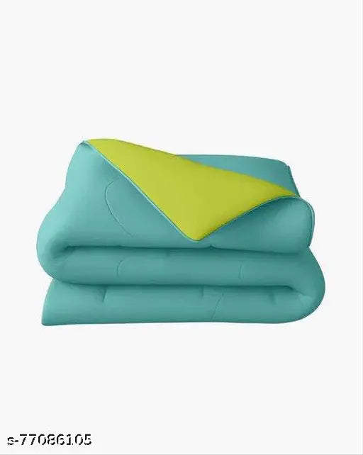 Olive green and aqua green comforter (54x84, 200GSM single), polyester blend. Soft, all-season reversible duvet for added warmth and style in the bedroom