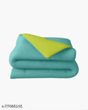 Olive green and aqua green comforter (54x84, 200GSM single), polyester blend. Soft, all-season reversible duvet for added warmth and style in the bedroom