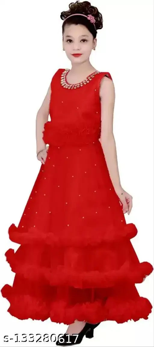 Embellished net high low kids gown, silvery pink or light green, suitable for parties and celebrations. Made from satin fabric with corsage detail, size range from 6-12 years old, Indian origin