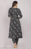 Women's rayon printed Anarkali kurti with palazzo set, three-quarter sleeves, colorful pattern, Indian ethnic wear on mannequin
