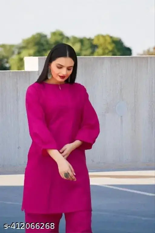 Cotton blend Rani color cord set in solid pattern, three-quarter sleeves. Women's casual top and palazzo bottom set for summer fashion. India origin