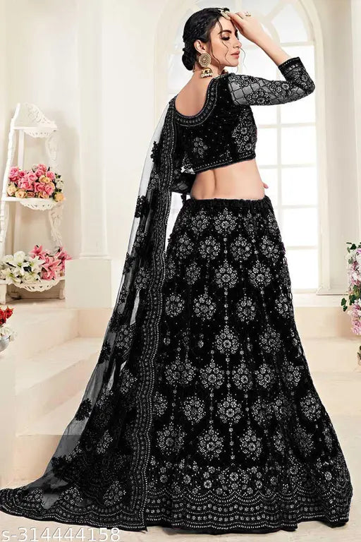 Semi-stitched women's net lehenga choli and dupatta, embroidered with intricate Indian patterns, size 42/44