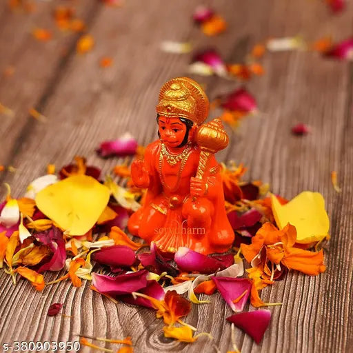 Handpainted Orange Hanuman Ji Idol for Success & Home Decoration, intricately detailed religious figurine for Pooja Room or gifting. Durable poly resin material with long-lasting colors. Easily cleanable with dry cotton cloth. Perfect for home decor, living room, office desk, or as a unique gift. Made in India