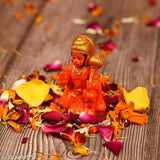 Handpainted Orange Hanuman Ji Idol for Success & Home Decoration, intricately detailed religious figurine for Pooja Room or gifting. Durable poly resin material with long-lasting colors. Easily cleanable with dry cotton cloth. Perfect for home decor, living room, office desk, or as a unique gift. Made in India