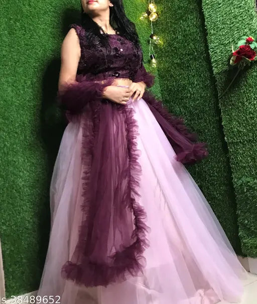 Pink jute and silk lehenga choli with net dupatta, embellished top and solid-colored ruffle dupatta