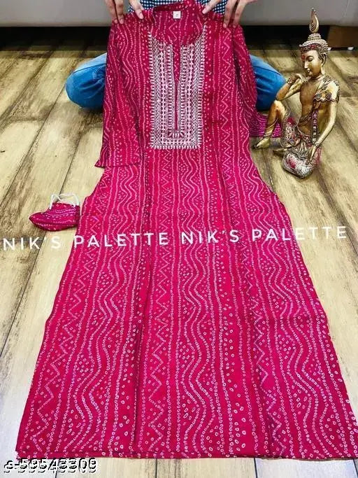 Premium rayon Sanganeri Bandhani kurti with casual neckline, printed combo of florals and abstract designs, lightweight layers, tassel details, contrasting trims, cuff details, and casual elegance. India-origin