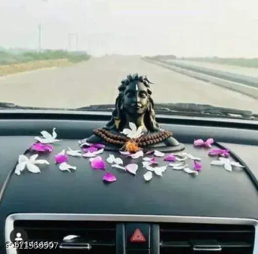 Black resin Adiyogi Shiva dashboard figurine. Crescent moon top, ideal spiritual gift." (91 characters)