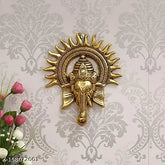 Metal Ganesh idol with Surya Chakra, brass finish and antique gold plating, traditional Indian decorative showpiece for worship or home decor, 18 cm x 23 cm x 3 cm size