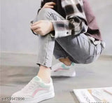 White synthetic casual sneakers for women, colorblocked design with PVC sole on display