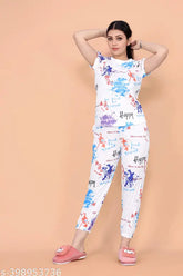 White cotton blend floral round nightsuits for women, featuring a shirt top and pyjama bottoms with short sleeves and printed net pattern. Perfect for casual brunch, professional meetings, or nights out. Mix-and-matchable with other wardrobe staples. Made in India (N: 1, XS-XL sizes available)
